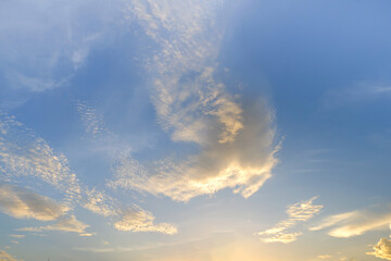 Fototapeta premium Landscape fantastic Sunset or sunrise with rays of light through the sky. Beautiful white clouds and blue sky high definition skyscraper with grunge texture for background Abstract,nature art style,