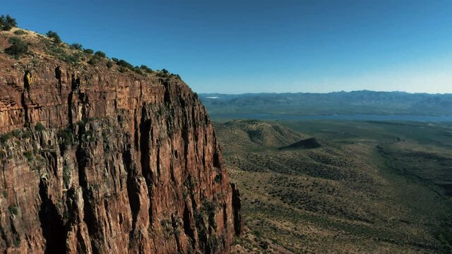 Aerial drone view of forests and cliffs at Theodor Roosevelt lake overlook in Tonto National Forest in Arizona, United States