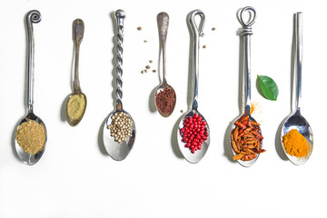 Various of spices in beautiful spoons on white background. Space for text, top view