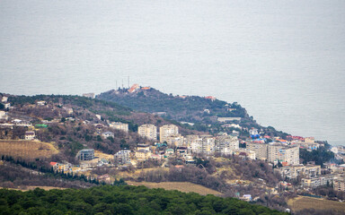 view of the city by the sea from the cliff