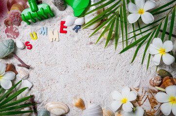colorful summer text with Shells and plumeria flowers on sand background, copy space