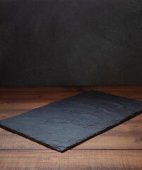 slate stone tray at wooden table - 392637257