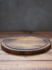 pizza cutting board at wooden table