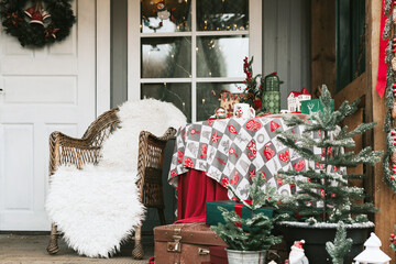 the porch of the rural house decorated for Christmas