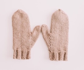 Warm knitted mittens isolated on white background. Christmas New Year minimal festive holiday composition. Flatlay, top view