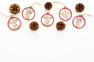 Spruce branch, cones and vintage toys decoration on christmas or new year on white background .