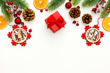 Spruce branch, cones and vintage toys decoration on christmas or new year on white background .