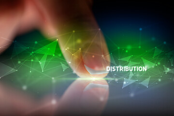 Finger touching tablet with DISTRIBUTION inscription, business concept