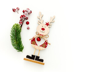 Christmas deer made of wood on white background top view, mockup