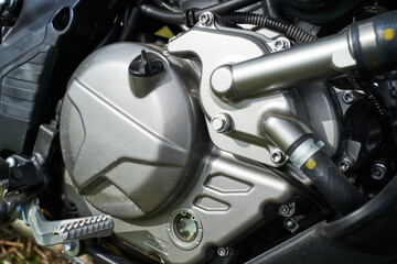 Fototapeta premium The powerful engine of a modern motorcycle closeup. The layout of the motor