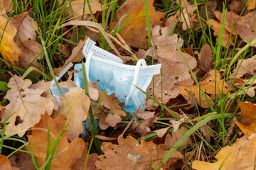 The 2020 pollution in nature. The used Corona disposable masks are popping up everywhere.