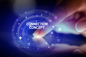 Finger touching tablet with social media icons and CONNECTI N CONCEPT