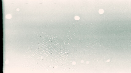 Noisy film frame with heavy scratches, dust and fingerprint