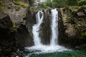 Fototapeta na wymiar Double waterfall in a forest