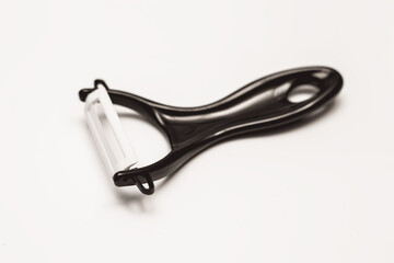 close up of a peeler on white background