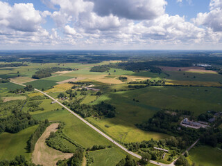 Obraz premium countryside aerial landscape with roads and green fields in summer
