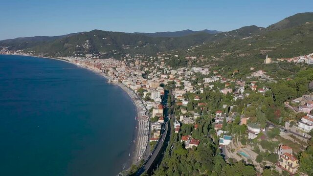 drone rising up and revealing Alassio, Liguria