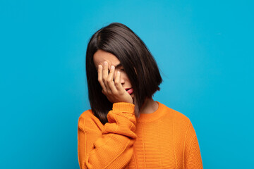 hispanic woman feeling bored, frustrated and sleepy after a tiresome, dull and tedious task,...