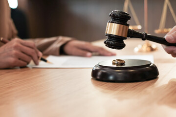 Fototapeta na wymiar Judge gavel deciding on marriage divorce signing papers. lawyer concept.