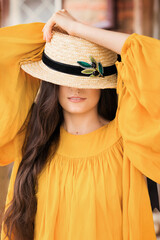 Young attractive girl in a handmade chic hat