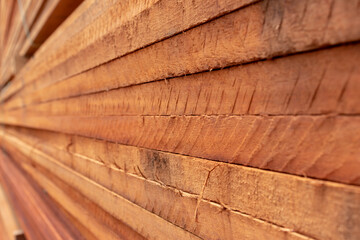 Closeup on a stack of lumber planks.