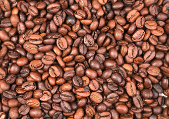 Roasted coffee beans, top View, background. Concept of food funds.