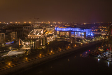 Naklejka na ściany i meble Hungary - Budapest with the National Theatre at night with drone view