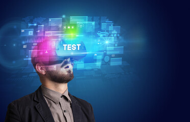 Businessman looking through Virtual Reality glasses with TEST inscription, innovative security concept