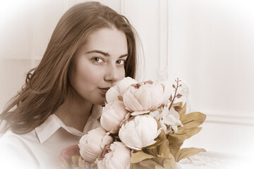 Beautiful young girl close up portrait with flowers.