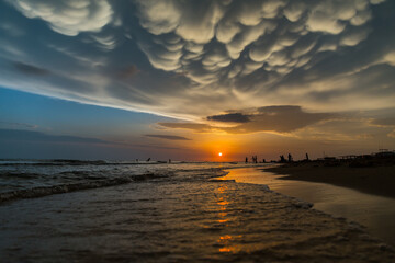Sunset with beautiful clouds over the seashore