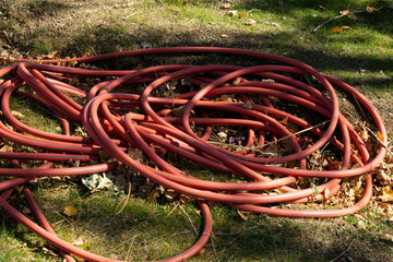 close up red irrigation hose