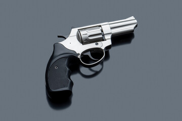 Silver revolver pistol on a light back. The classic weapon of the wild west in modern performance.