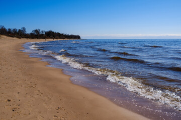 Fototapeta na wymiar sea shore in summer beach with blue water waves and sand