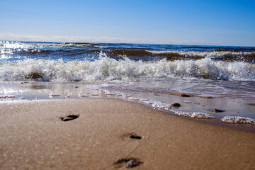 sea shore in summer beach with blue water waves and sand