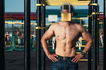 Fototapeta na wymiar A barn lock instead of a human head. Concept of protection of personal data, hiding identity.