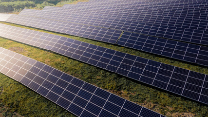 Close up solar power station panels in a row in the fields green energy at sunset landscape electrical ecology innovation nature environment