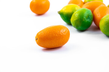 Small citrus kumquat fortunella macro photo on white isolated background