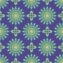 vector green and yellow ethnic mandala seamless pattern on violet