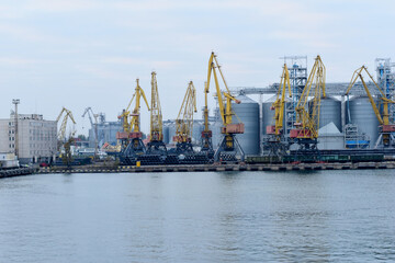 Fototapeta na wymiar Large loading cranes in the port of Odessa.