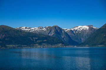 Fototapeta premium Mountains in the distance at a fjord