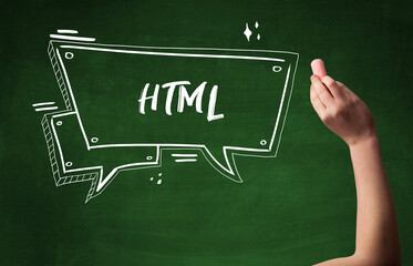 Hand drawing HTML abbreviation with white chalk on blackboard