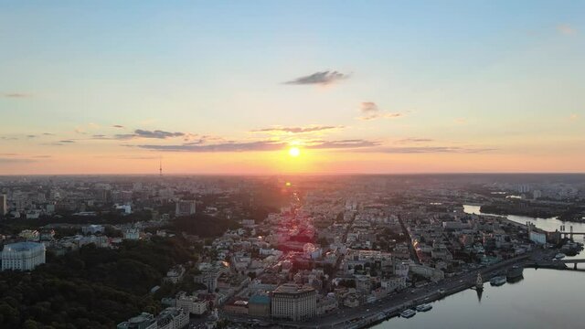 Aerial view of Kyiv with the sunset and the Dnipro river.