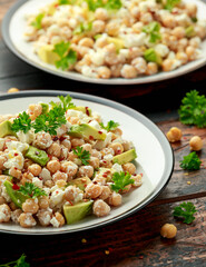 Chickpeas salad with feta cheese, avocado and herbs. healthy food