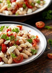 White Bean Salad with Cherry Tomatoes, Feta cheese and parsley. Healthy vegetarian, vegan food
