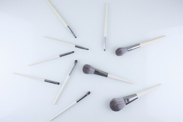 white makeup brushes on an isolated background