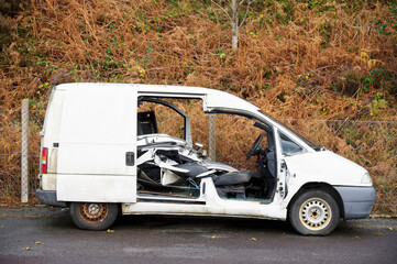White van vandalised and abandoned in rural countryside