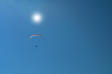 paragliding in the blue sky,flying, fly, sport, paraglider,extreme, air, gliding, freedom, adventure, glider, sun,
