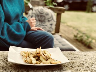 roast potatoes served on a wooden table in the garden