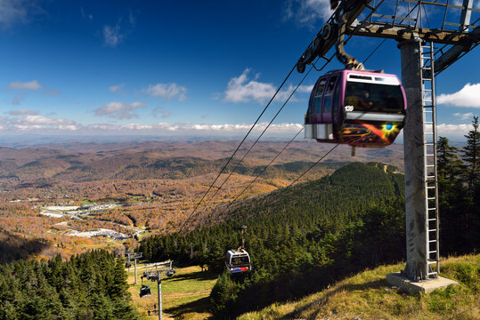 Express Gondola at Killington Mountain Resort in Fall with hikers K1 lodge and Golf course Killington, Vermont - October 12, 2014