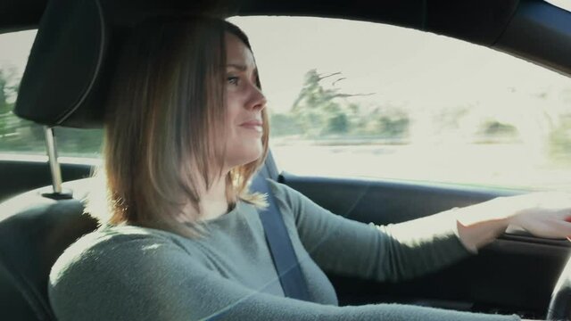 Sad woman crying while driving car for loosing job coronavirus problems
